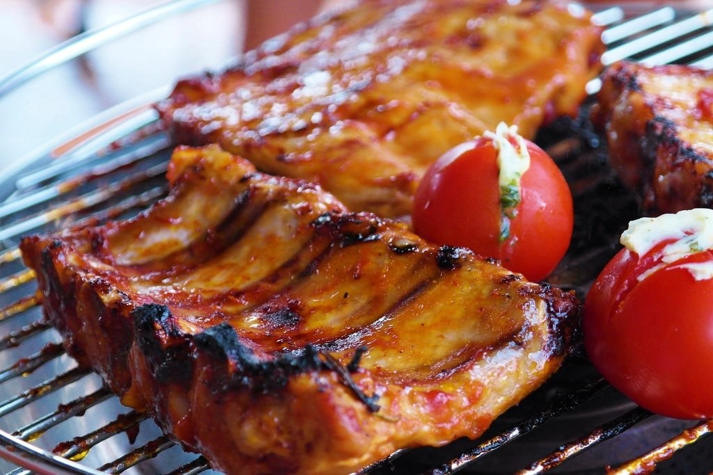 Glazed barbecue ribs on the grill grate